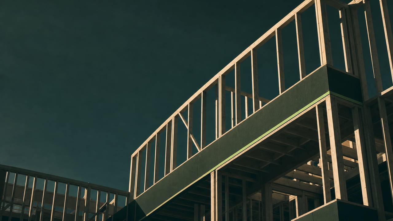 Residential timber frame under construction at golden hour