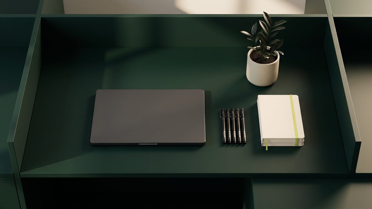 Tidy desk from above with drafting pens and a notebook