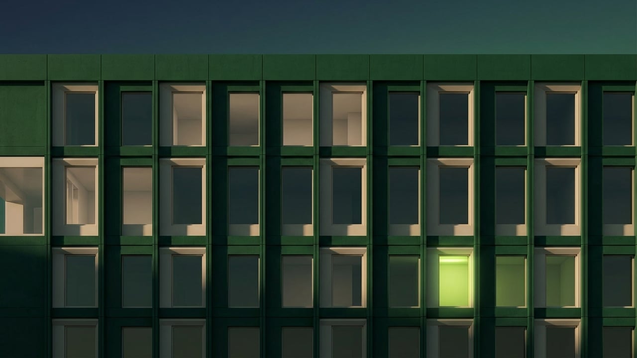 Modern facade with a repeating window grid at dusk