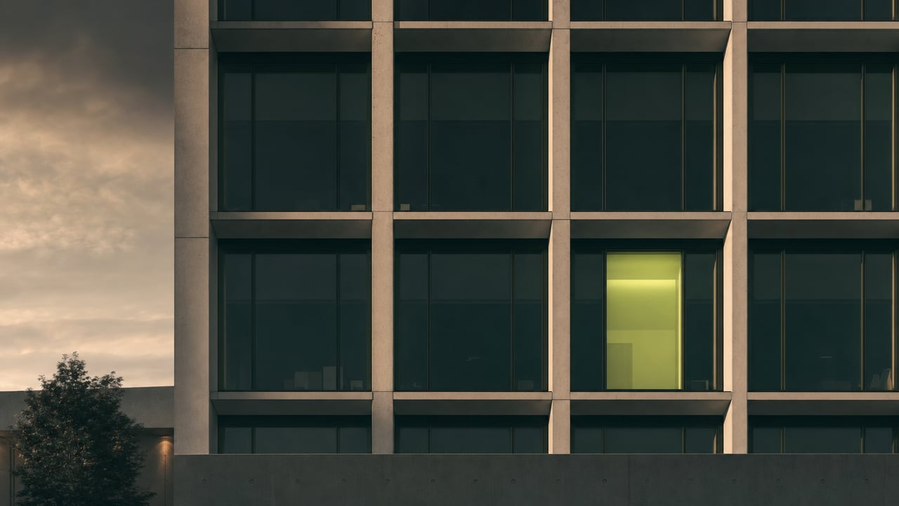 Modern facade with a repeating window grid at dusk
