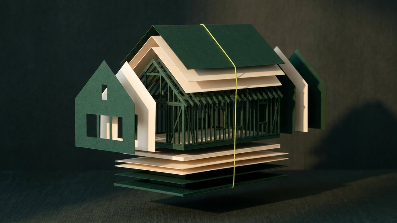 Exploded paper model of a house in cream and dark green